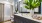 a bathroom with a large mirror at The Shores at Lake Howell Apartments in Casselberry, FL