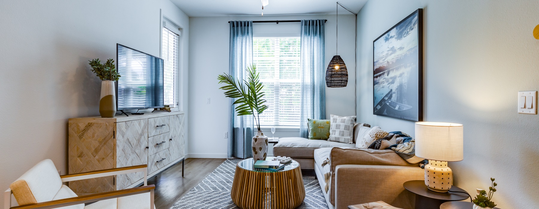 a living room with a couch and a coffee table at The Shores at Lake Howell Apartments in Casselberry, FL